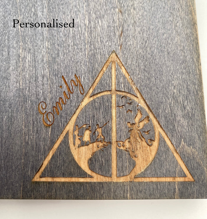 Wooden notebook with a 'Deathly Hallows' design and personalised with 'Emily' engraved.