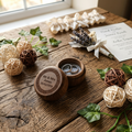A personalised wood ring box. Set on a rustic table with wedding rings on a wedding day.