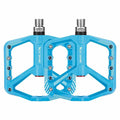 Blue wide bicycle pedals with non-slip surface and lightweight design
