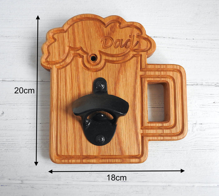 Wooden bottle opener shaped like a beer glass with 'Dad' engraved, on a white wooden surface.